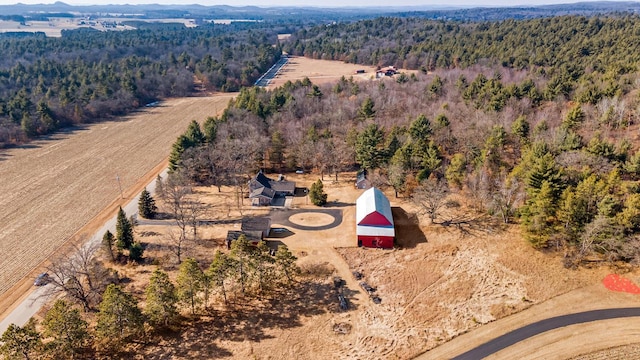 birds eye view of property with a forest view