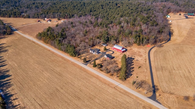 drone / aerial view featuring a forest view