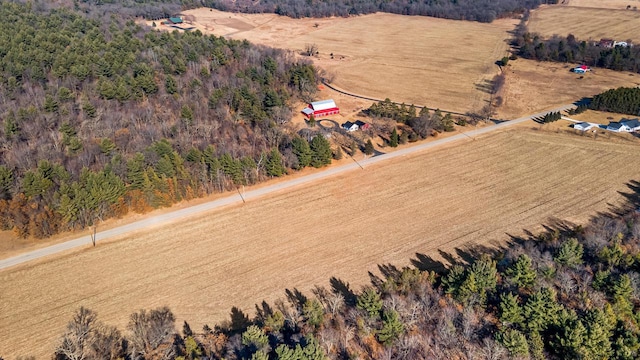 drone / aerial view with a forest view and a rural view