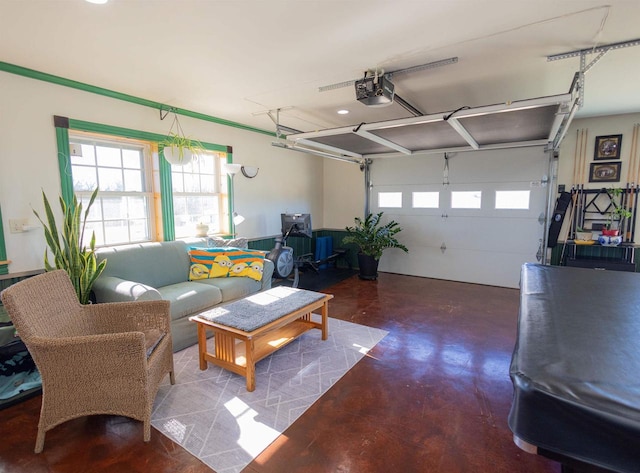 living area with a garage and finished concrete floors