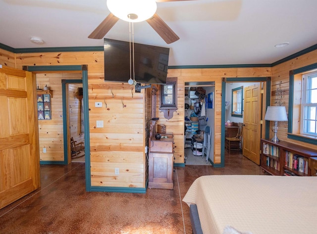 bedroom featuring wood walls