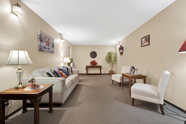 living area featuring carpet floors and baseboards