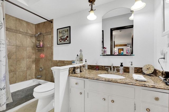 bathroom with tile patterned floors, vanity, toilet, and shower / tub combo with curtain