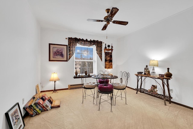 carpeted dining space with baseboards, a baseboard heating unit, and ceiling fan