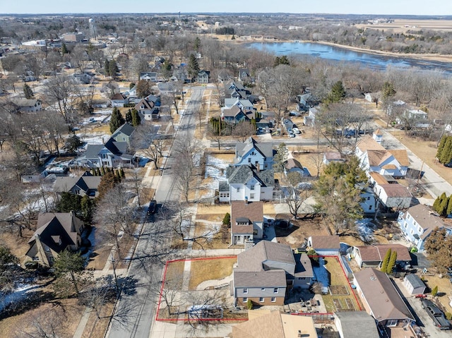 drone / aerial view with a residential view and a water view