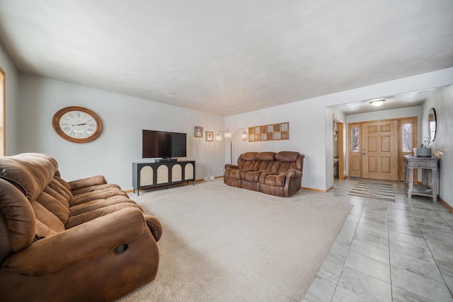 living room featuring baseboards and carpet flooring