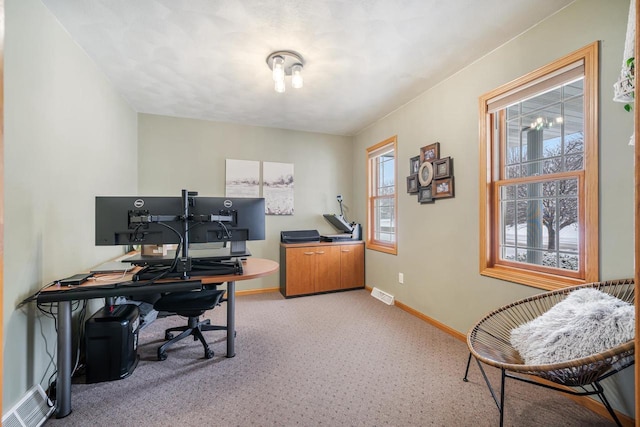 office featuring visible vents and baseboards