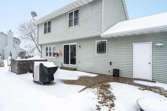 view of snow covered house