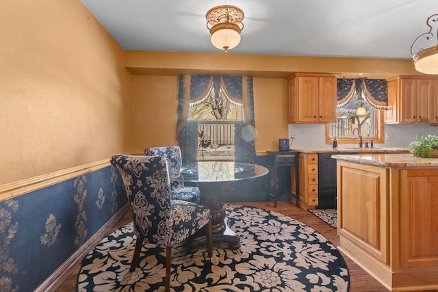 interior space featuring baseboards and wood finished floors