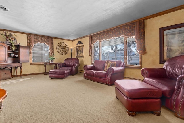 carpeted living room with ornamental molding, visible vents, and baseboards