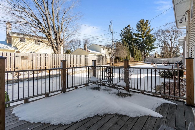 deck with a fenced backyard