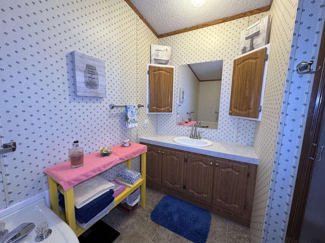 2701 E Main St Unit 118, Reedsburg, WI 53959 - bathroom with a textured ceiling, vanity, and wallpapered walls