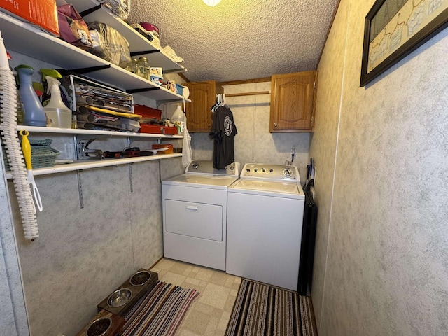 2701 E Main St Unit 118, Reedsburg, WI 53959 - laundry area with separate washer and dryer, cabinet space, light floors, and a textured ceiling