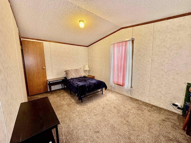 2701 E Main St Unit 118, Reedsburg, WI 53959 - carpeted bedroom featuring a textured ceiling, ornamental molding, and vaulted ceiling