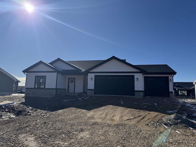 view of front of property featuring driveway and an attached garage