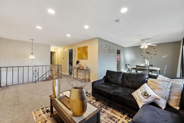 living room featuring recessed lighting, light carpet, and a ceiling fan