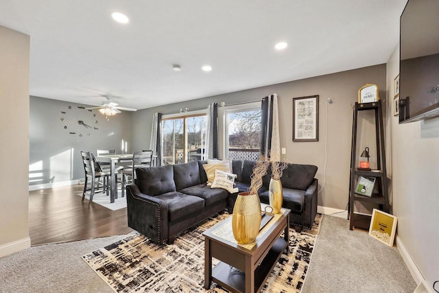 living room with wood finished floors, recessed lighting, baseboards, and ceiling fan