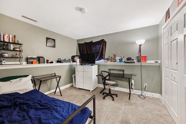 carpeted bedroom with baseboards and visible vents