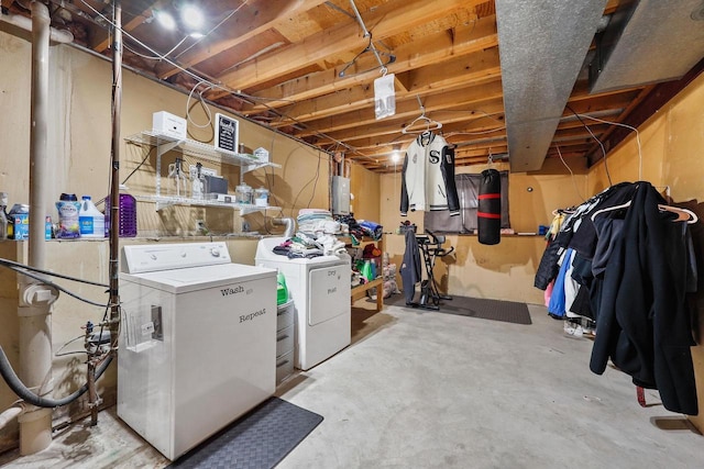 unfinished below grade area featuring independent washer and dryer