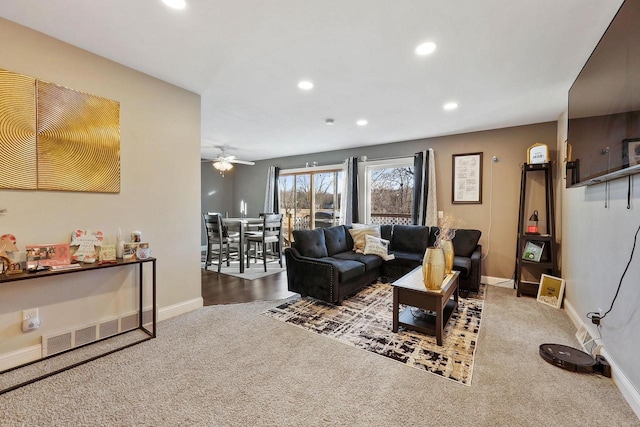 living area with carpet flooring, recessed lighting, and baseboards