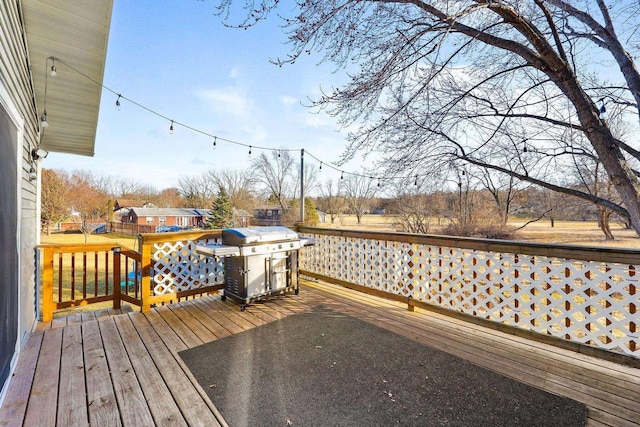 wooden deck featuring grilling area