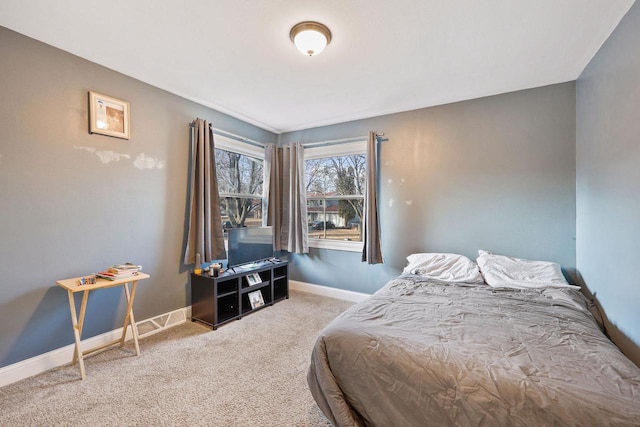 carpeted bedroom with baseboards