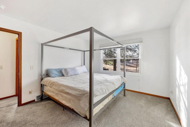 bedroom featuring carpet flooring and baseboards