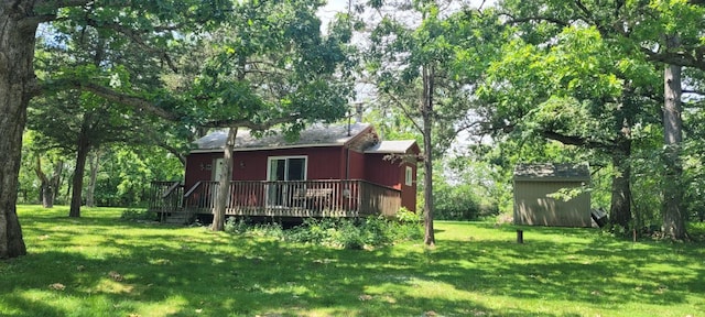 exterior space with a wooden deck and a yard