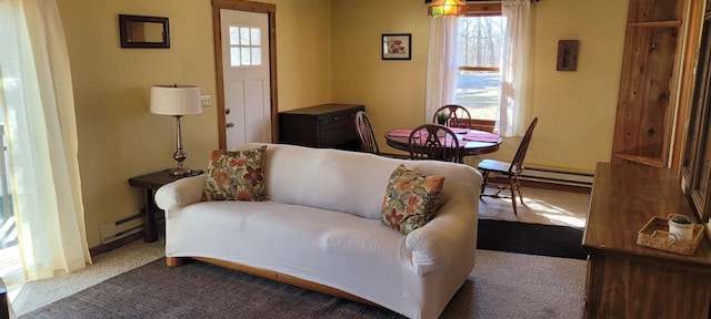 living area featuring carpet and baseboard heating