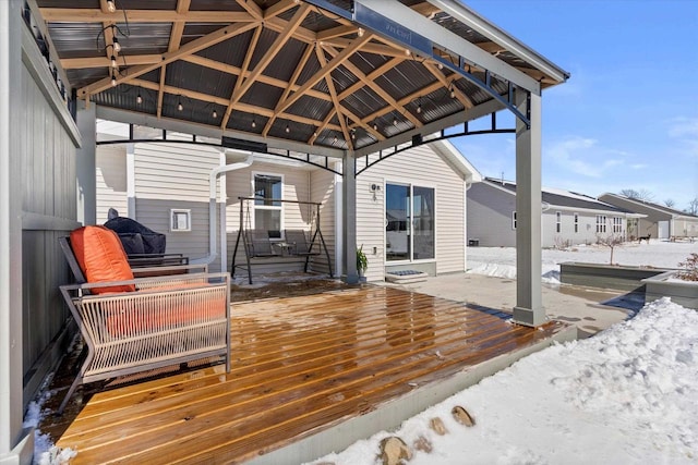 snow covered deck featuring a gazebo