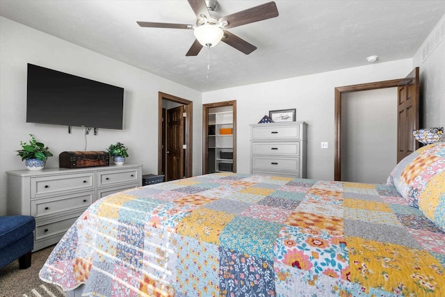 bedroom featuring ceiling fan and carpet flooring