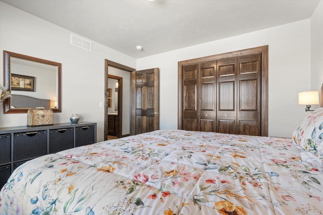 bedroom featuring visible vents and a closet