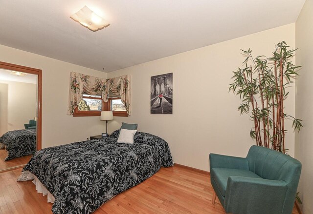 bedroom with wood finished floors