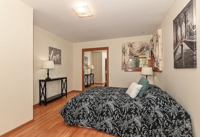 bedroom with wood finished floors