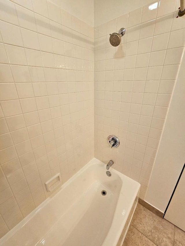 full bath featuring  shower combination and tile patterned flooring