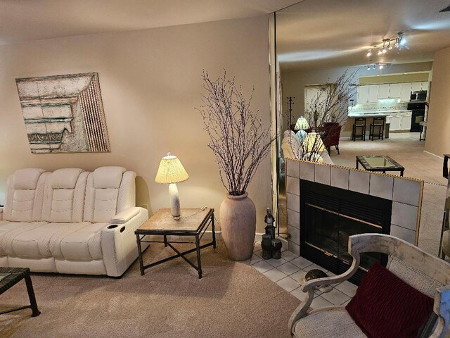 living room featuring tile patterned floors and a fireplace