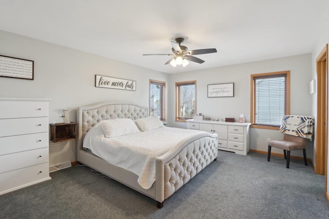 bedroom with baseboards, ceiling fan, and dark carpet