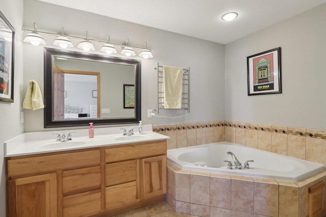 full bathroom with tile patterned floors, double vanity, a bath, and a sink