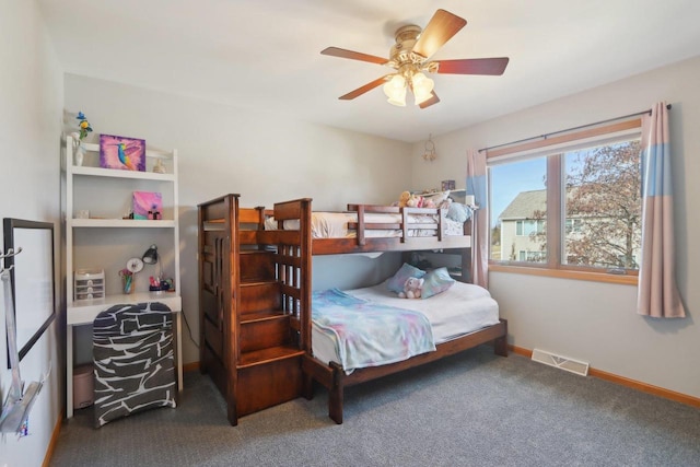 bedroom with visible vents, baseboards, and ceiling fan