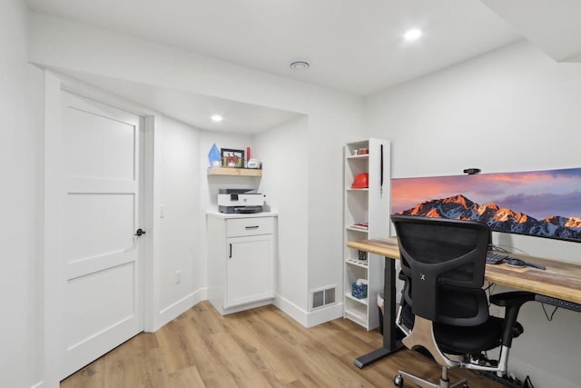 office space featuring recessed lighting, visible vents, light wood-style flooring, and baseboards