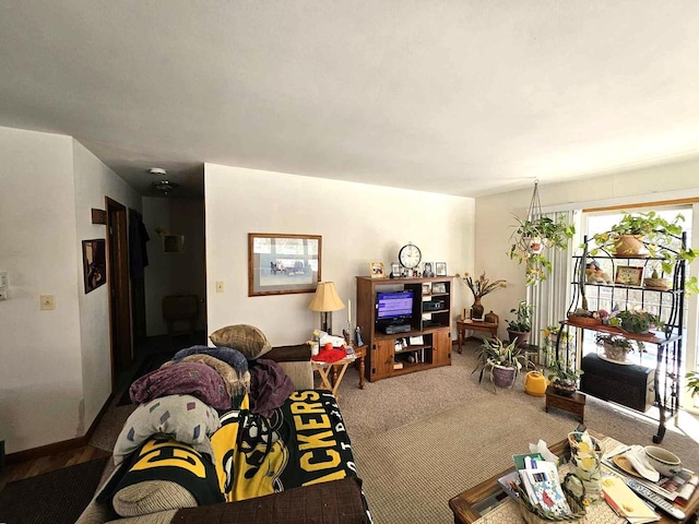 living room with carpet and baseboards