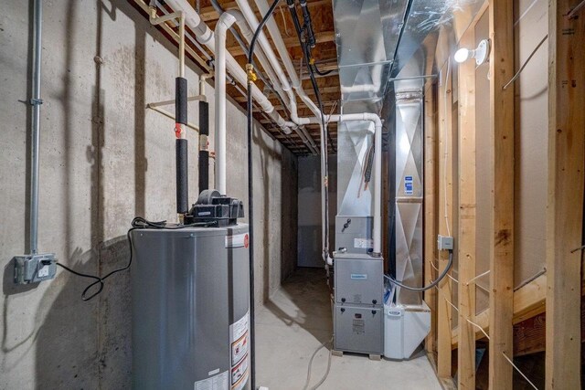 utility room with water heater and heating unit