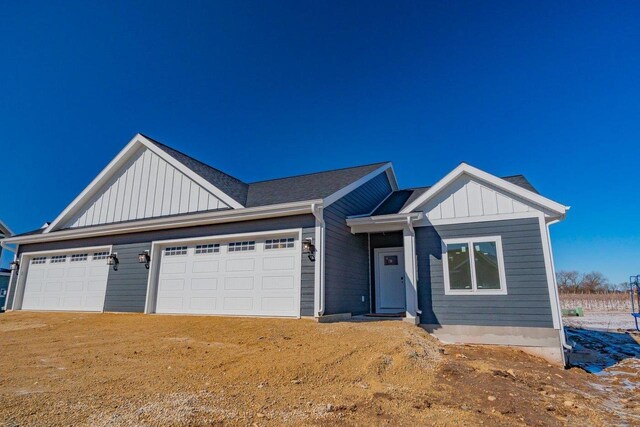 view of front facade featuring board and batten siding and an attached garage