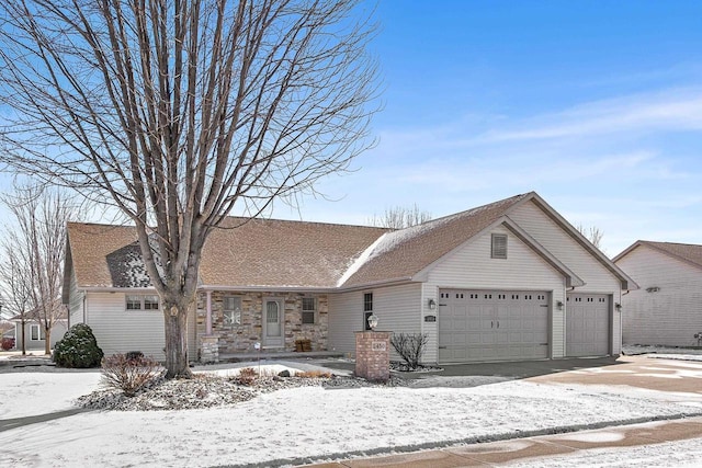 ranch-style house with a garage, driveway, and a shingled roof