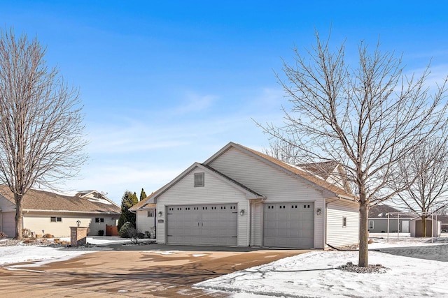 view of front of property with a garage and driveway