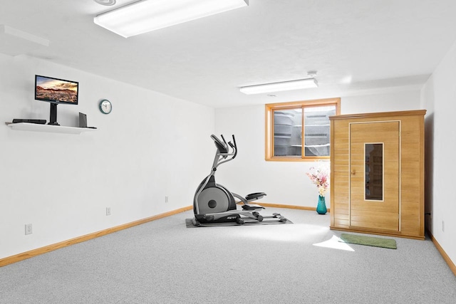 workout room with carpet floors and baseboards