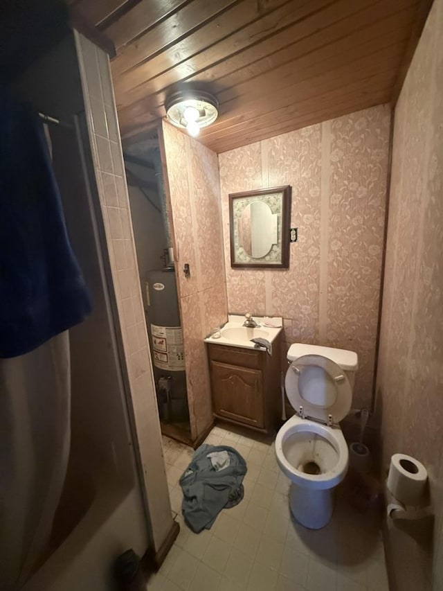 bathroom with wooden ceiling, toilet, vanity, water heater, and a shower