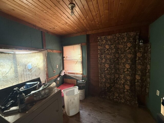 clothes washing area with washer / dryer, laundry area, wooden ceiling, and wood finished floors