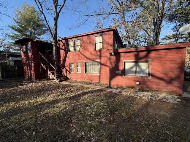 view of home's exterior with stairs