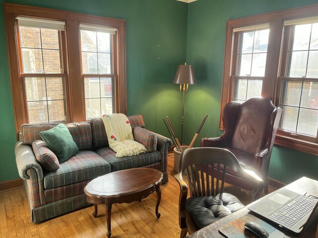 living area featuring wood finished floors and baseboards